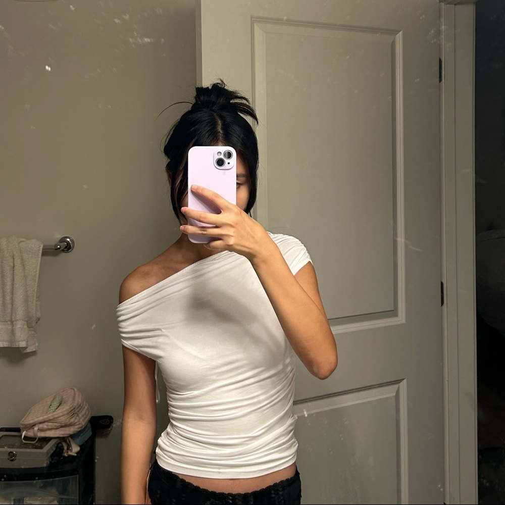 Brand new top with off shoulder asymmetric detail